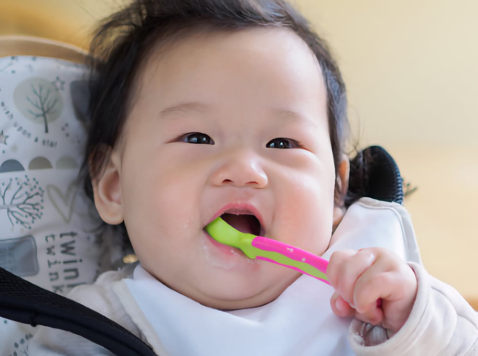 Baby brushing teeth