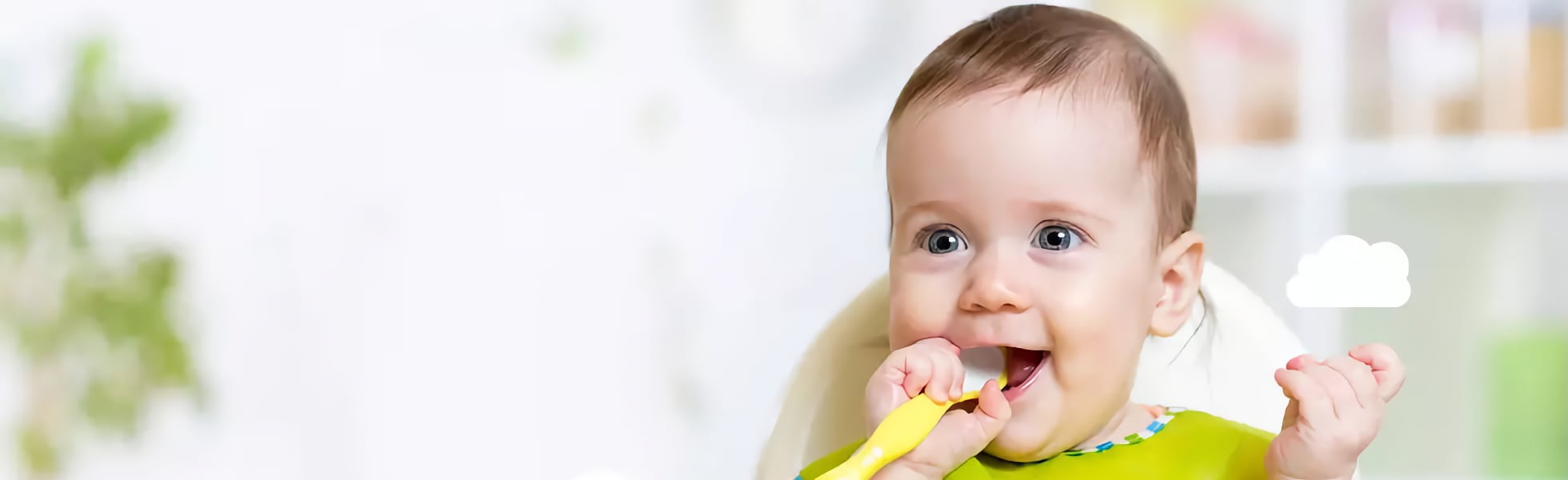 Baby eating at a high chair